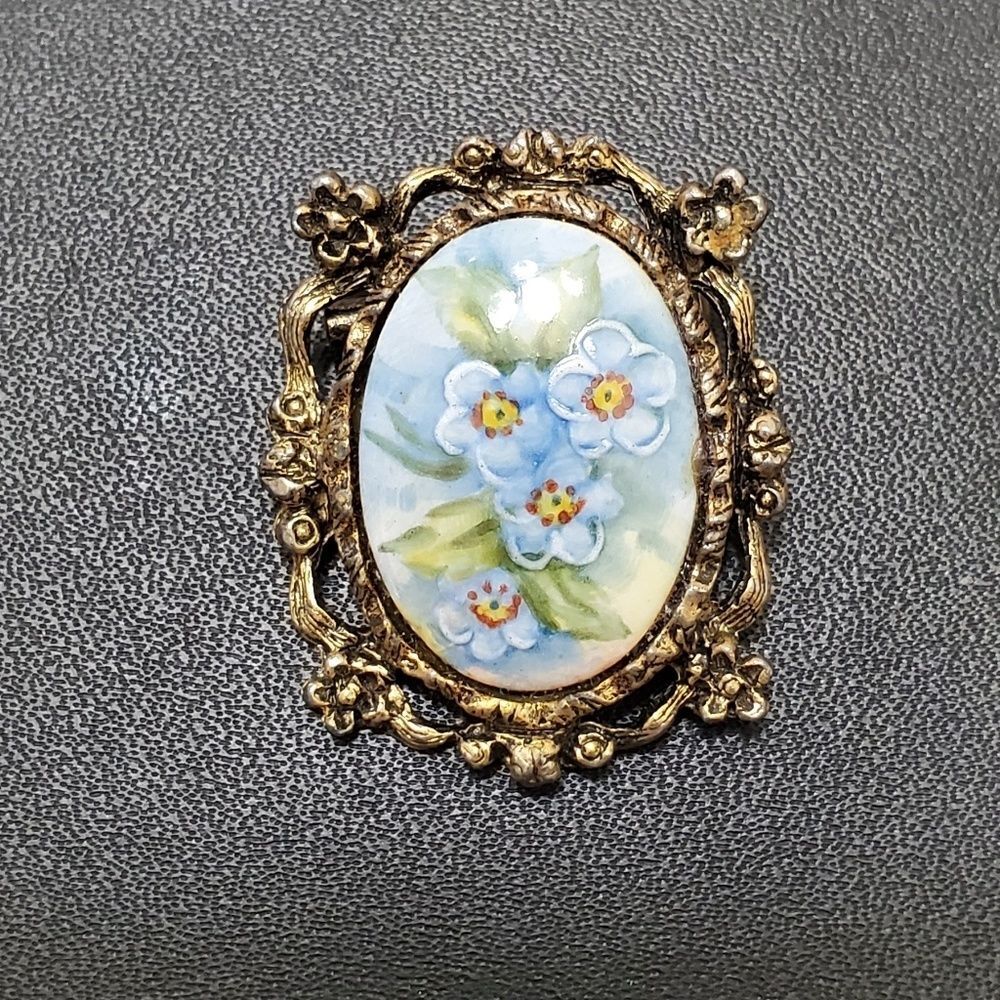 Vintage gold tone painted blue flower cameo brooch green